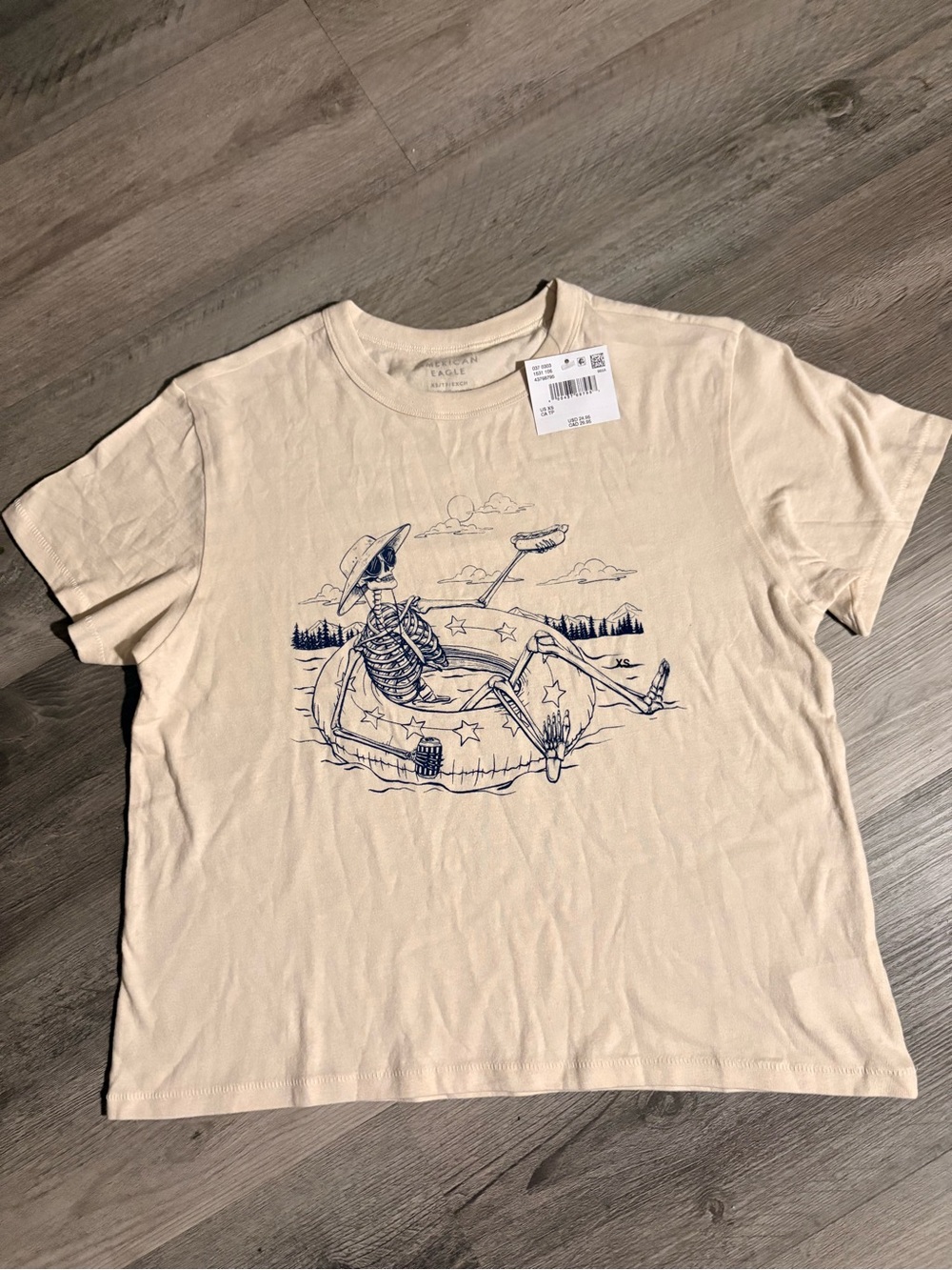 American Eagle Outfitters Cream Crop Tee with Navy Skeleton Float Graphic